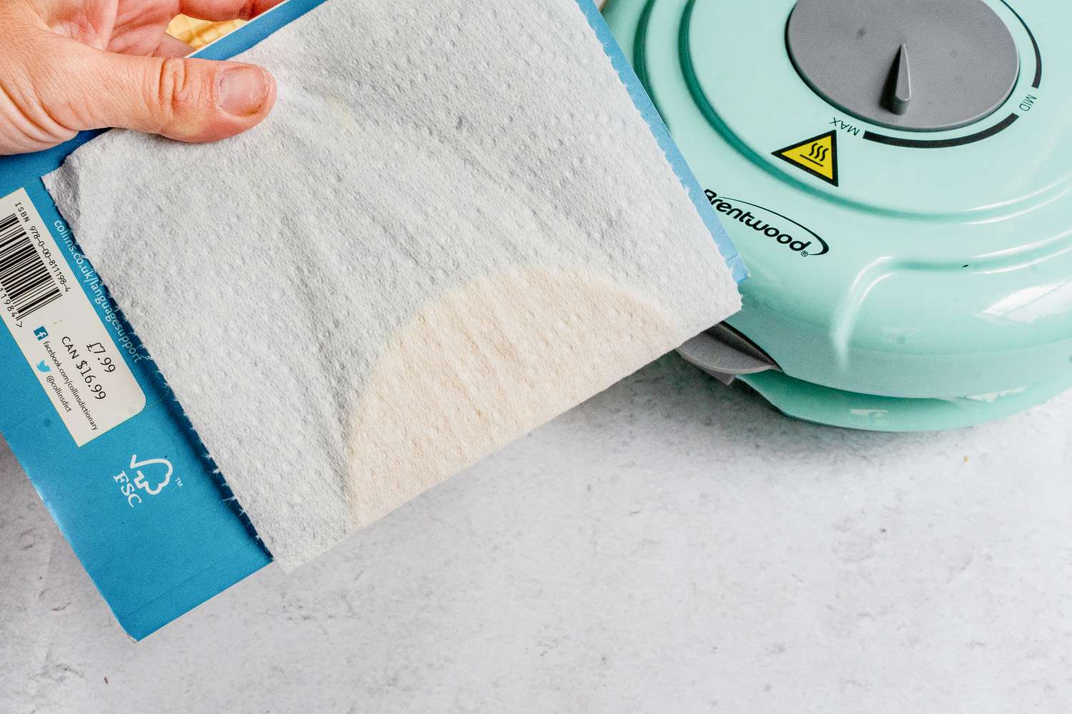 Use paper towel to wrap waffle shell around the book.