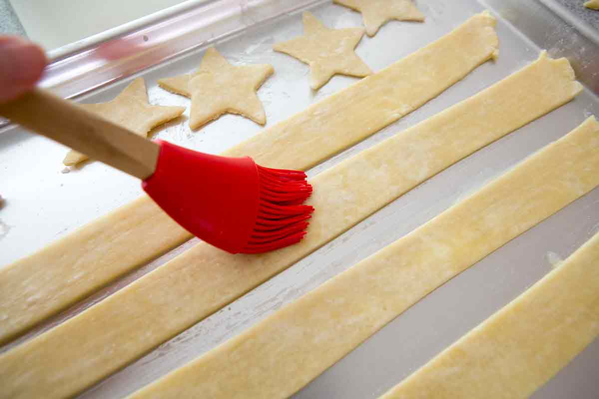 cut stars and stripes out of dough for american flag pie