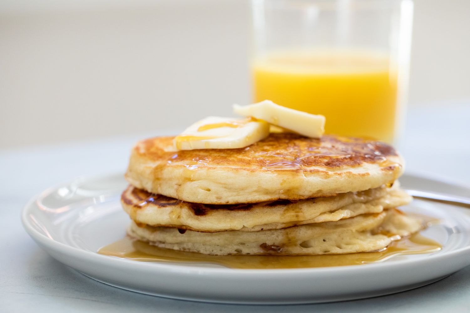 Pancakes and a glass of orange juice