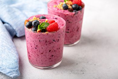 mixed berry smoothies topped with fresh fruit