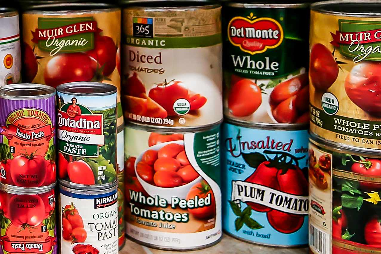 Various canned tomato products from different brands shown together