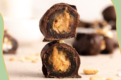 Two peanut butter-stuffed dates dipped in chocolate. 