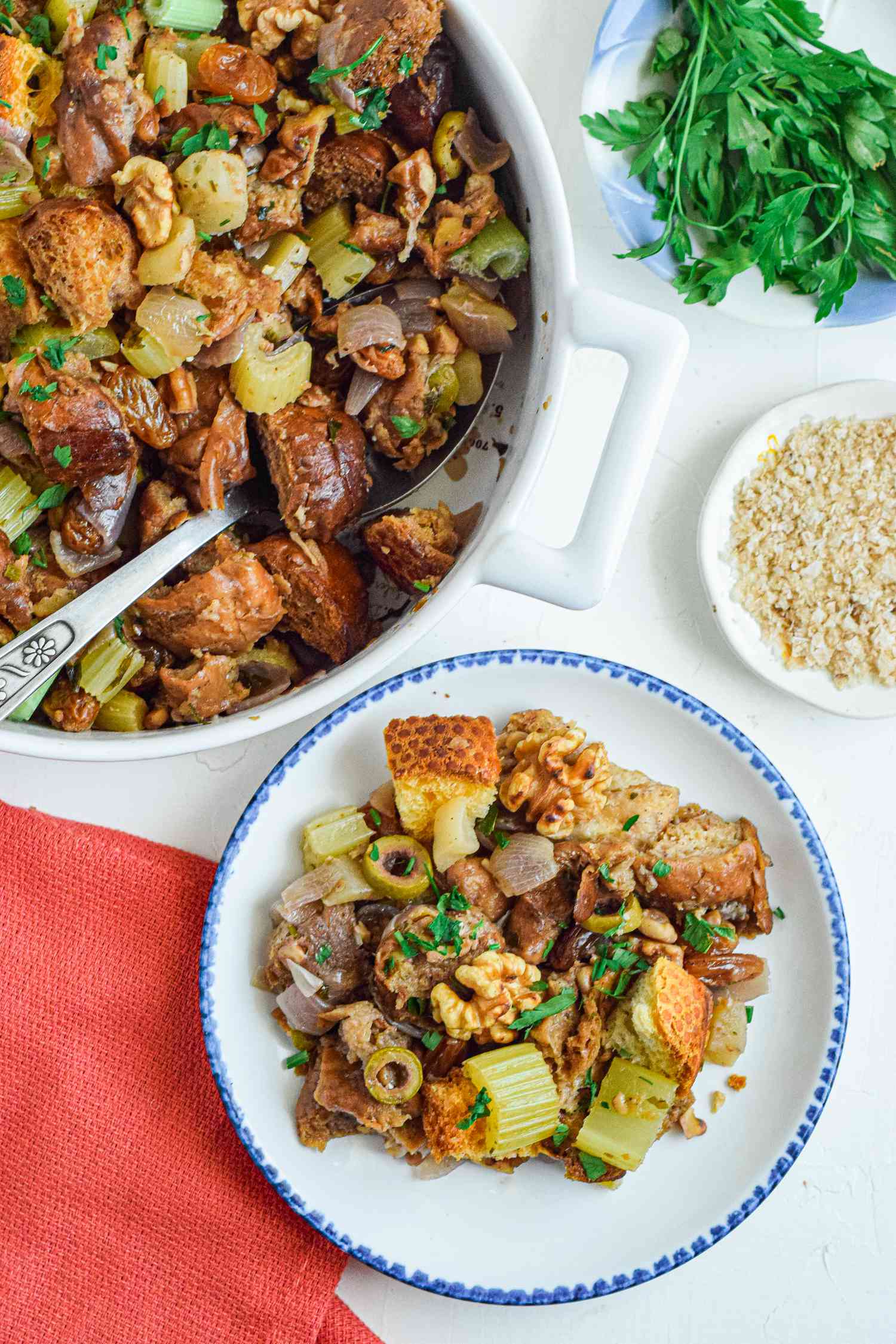 Overhead view of a plate of turkey dressing and a pot of easy stuffing recipe.