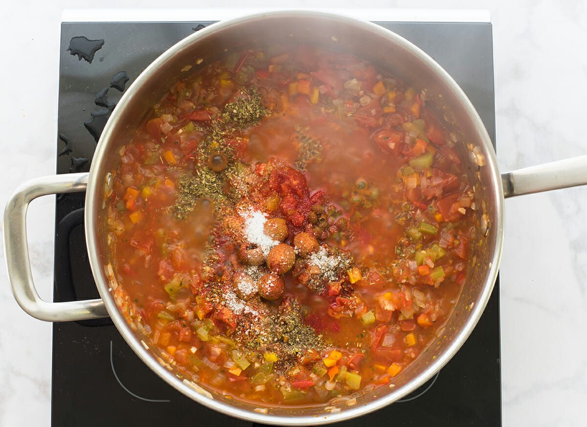 Puerto Rican Crab and Rice simmer the ingredients