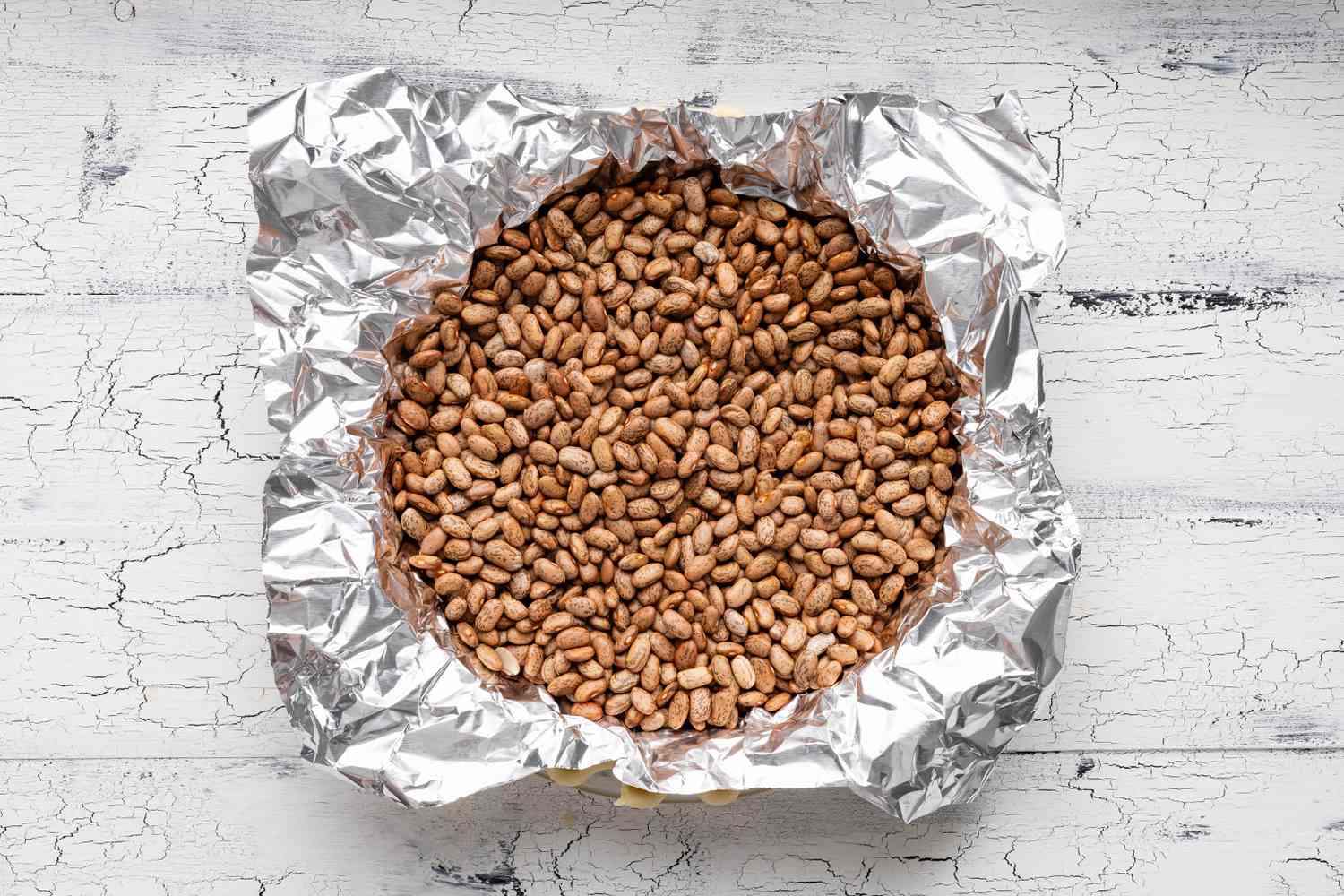 Pie Shell Covered in Aluminum and Dry Beans to Blind Bake the Pie Shell for Southern Chocolate Chess Pie Recipe 