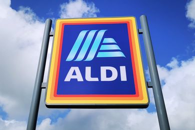 Aldi store sign against a cloudy sky