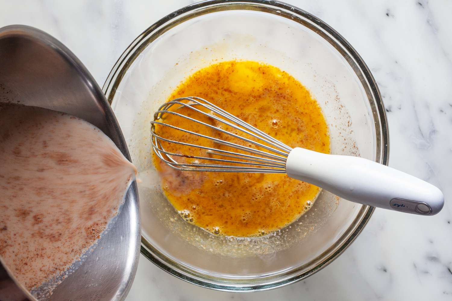 Tempering eggs for the custard for mexican chocolate.