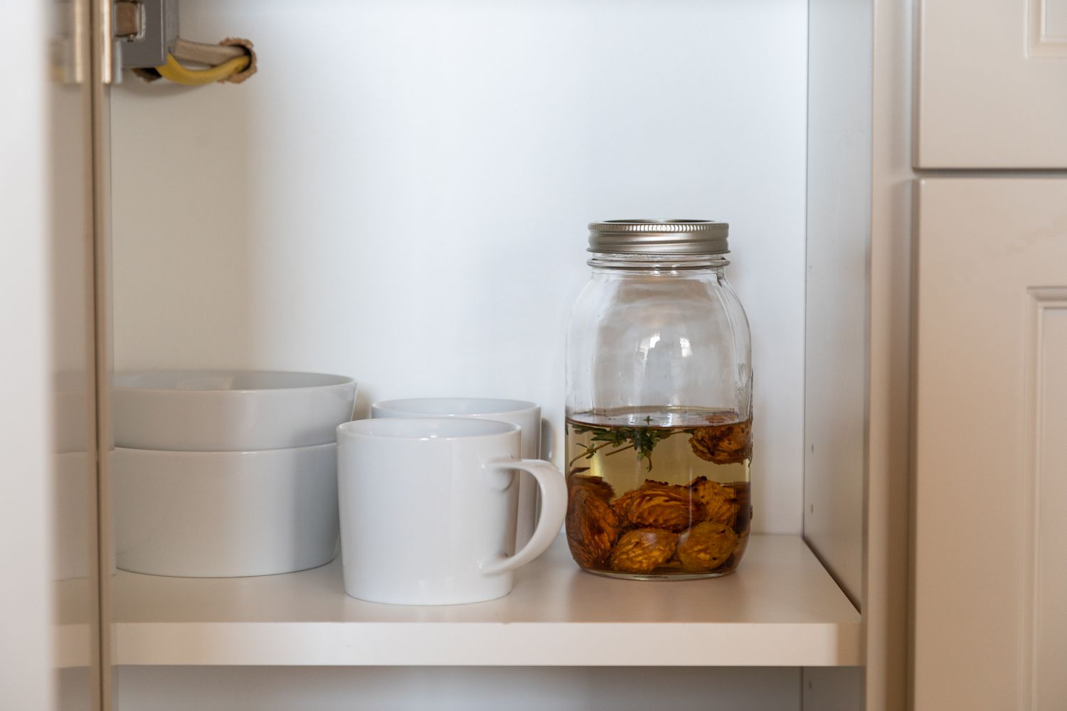 Infusing the vodka for 1 month for the stone fruit pit liqueur 