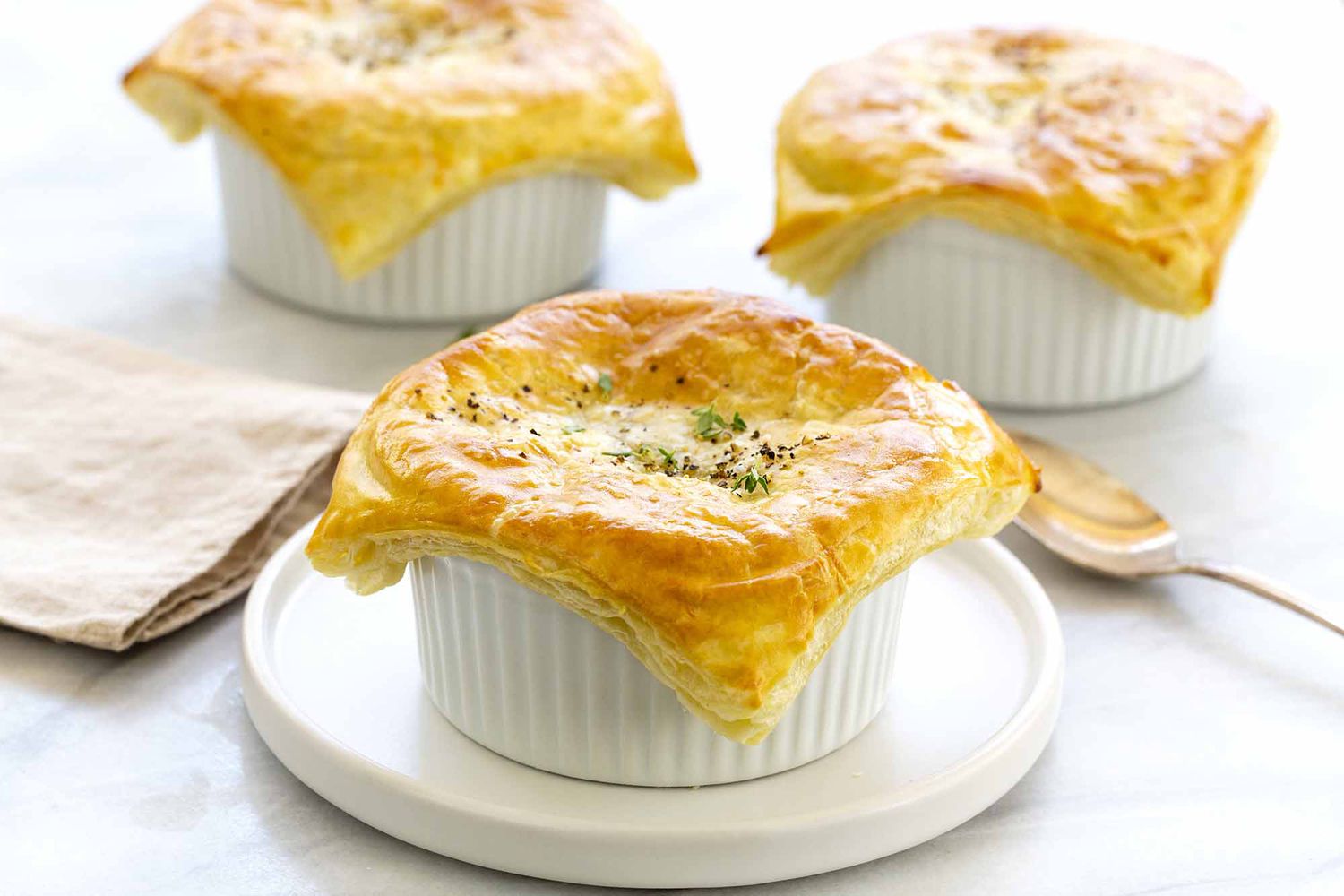 Three vegetable pot pies, ready to serve