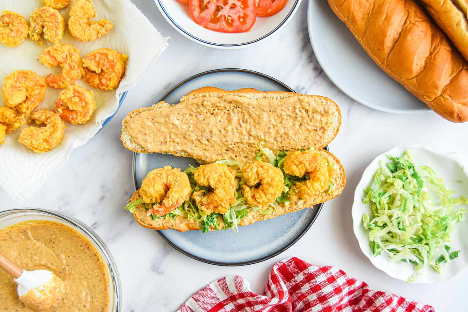Building the Classic Shrimp Po Boy Sandwich: Shrimp Added to Bread