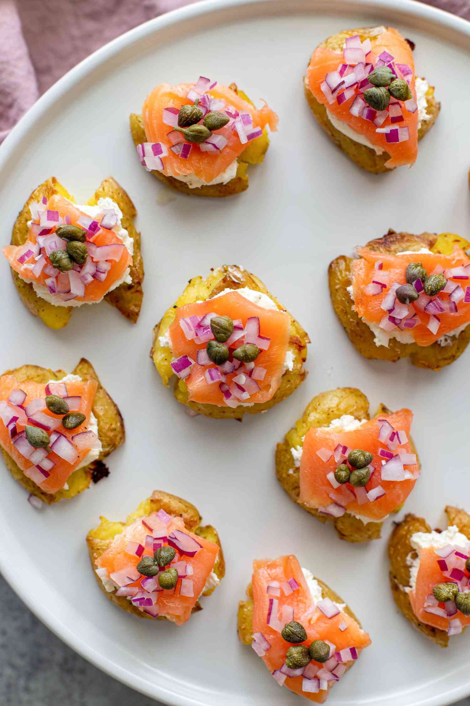 Overhead view of a platter of easy potatoes with smoked salmon.