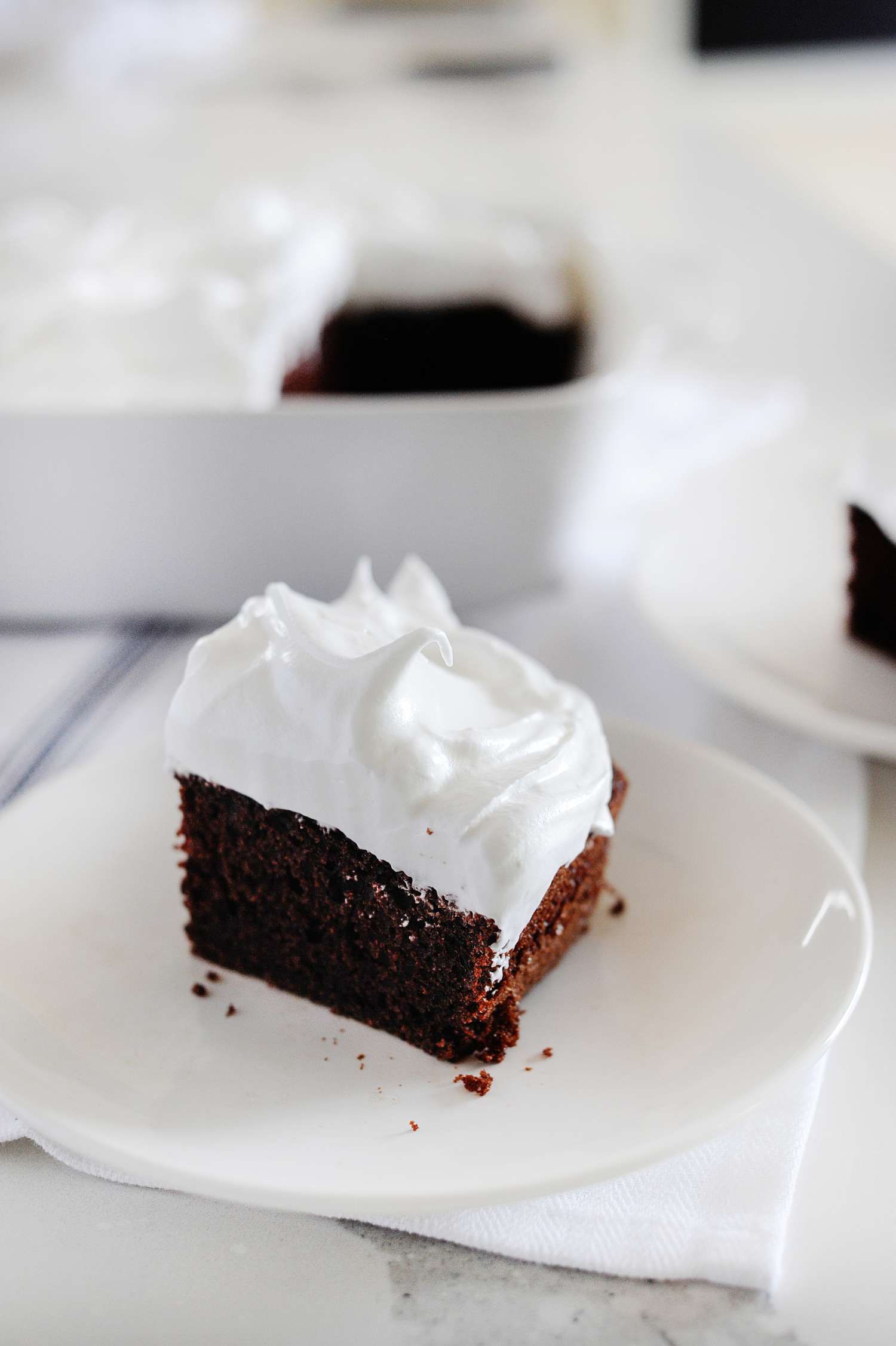 Strawberry Seven-Minute Frosting thickly spread on sheet cake.