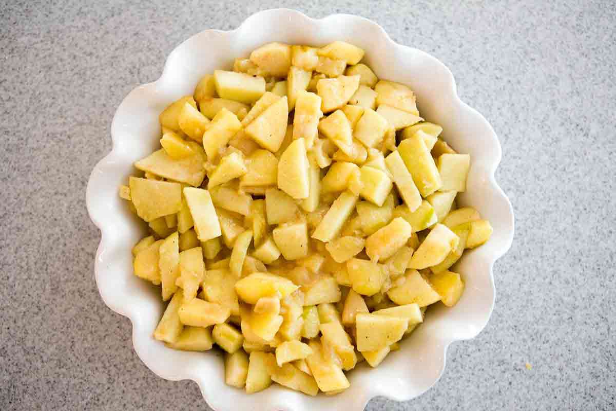 fill pie dish with pre-cooked apples for apple cobbler