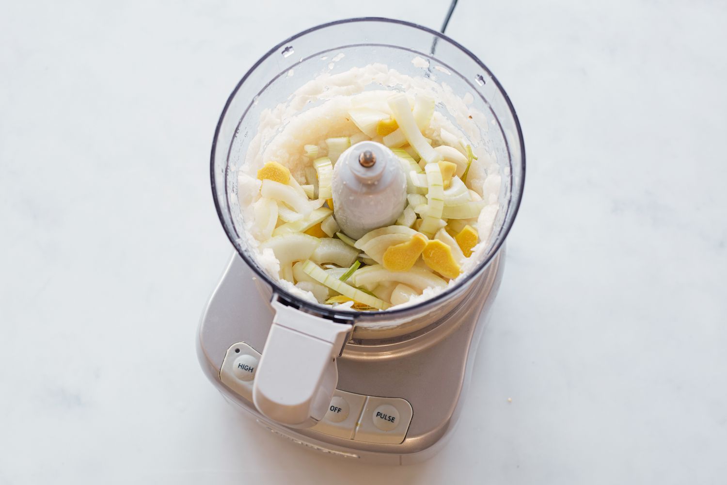 Pears and garlic in a food processor to make shortcut Korean braised short ribs .