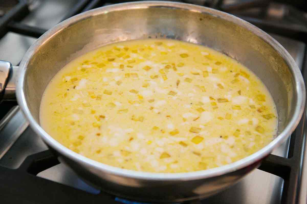 Adding coconut milk for curry shrimp
