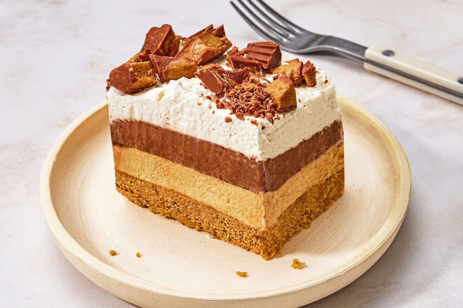 1 serving of Chocolate-Peanut Butter Delight on a plate with a fork