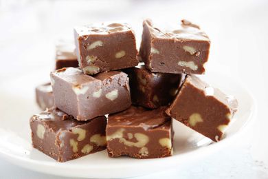 Easy fudge recipe cut into squares and stacked.