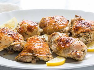 Lemon Chicken on a platter with lemon slices