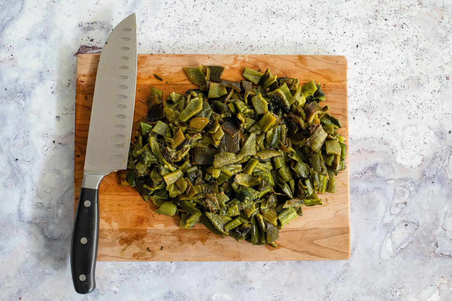 Peppers Cut on a Cutting Board into Bit Size Pieces for Poblano, Corn, and Cheese Tamales 