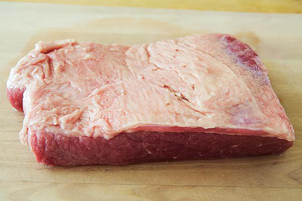 Raw cut of corned beef fat side up