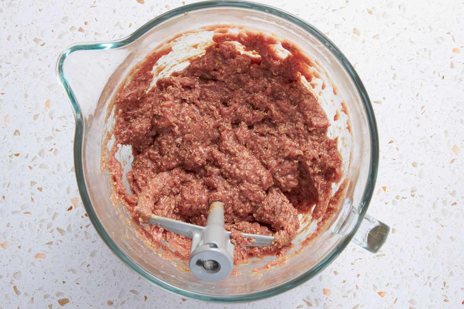 Meat Mixture in a Mixer Bowl After Being Mixed With Beef Stock