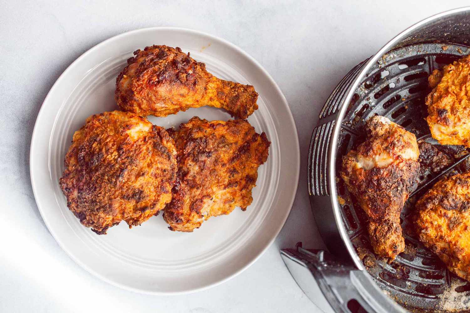 Fried Chicken pieces in an Air Fryer and also on a plate