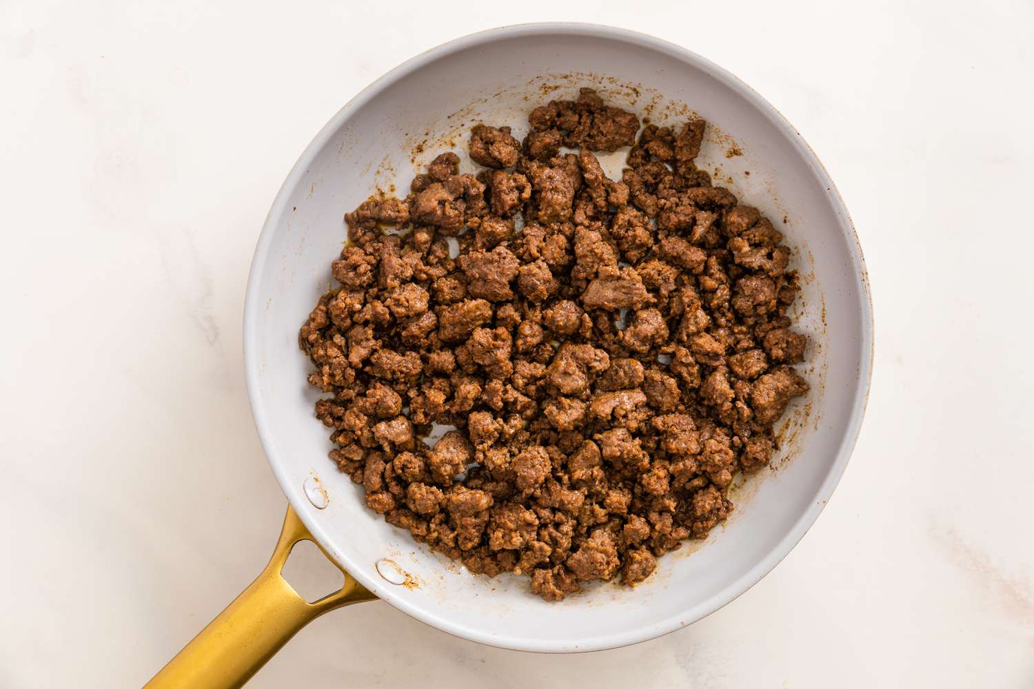 Cooked Beef Resting in the Skillet for Taco Pizza Recipe