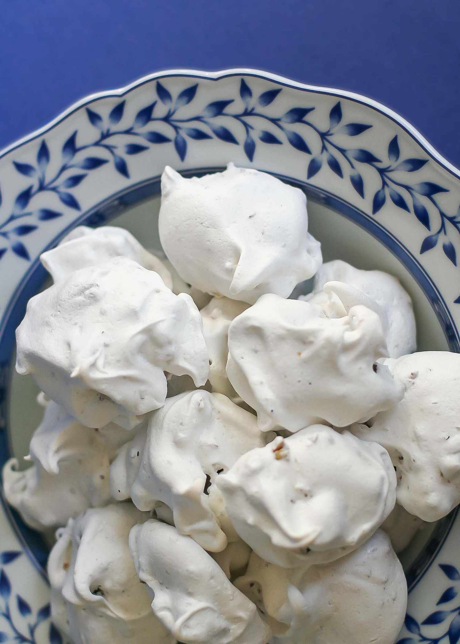 A pile of pecan meringue cookies on a plate