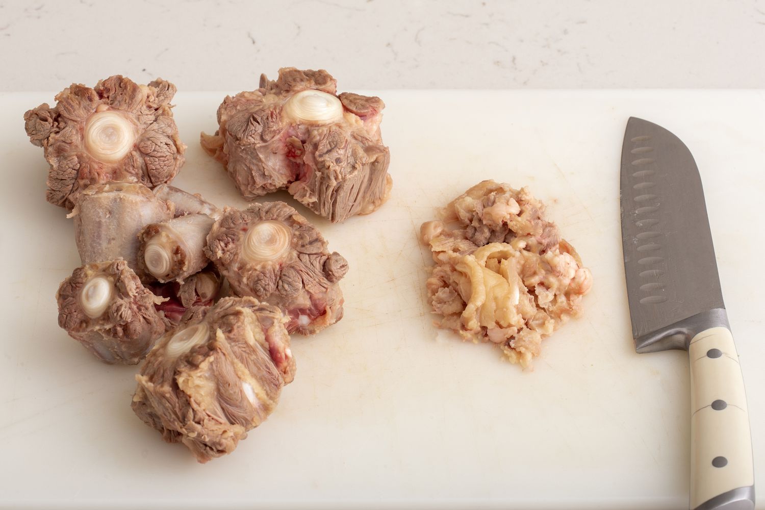 Cleaning the gristle off cooked oxtails