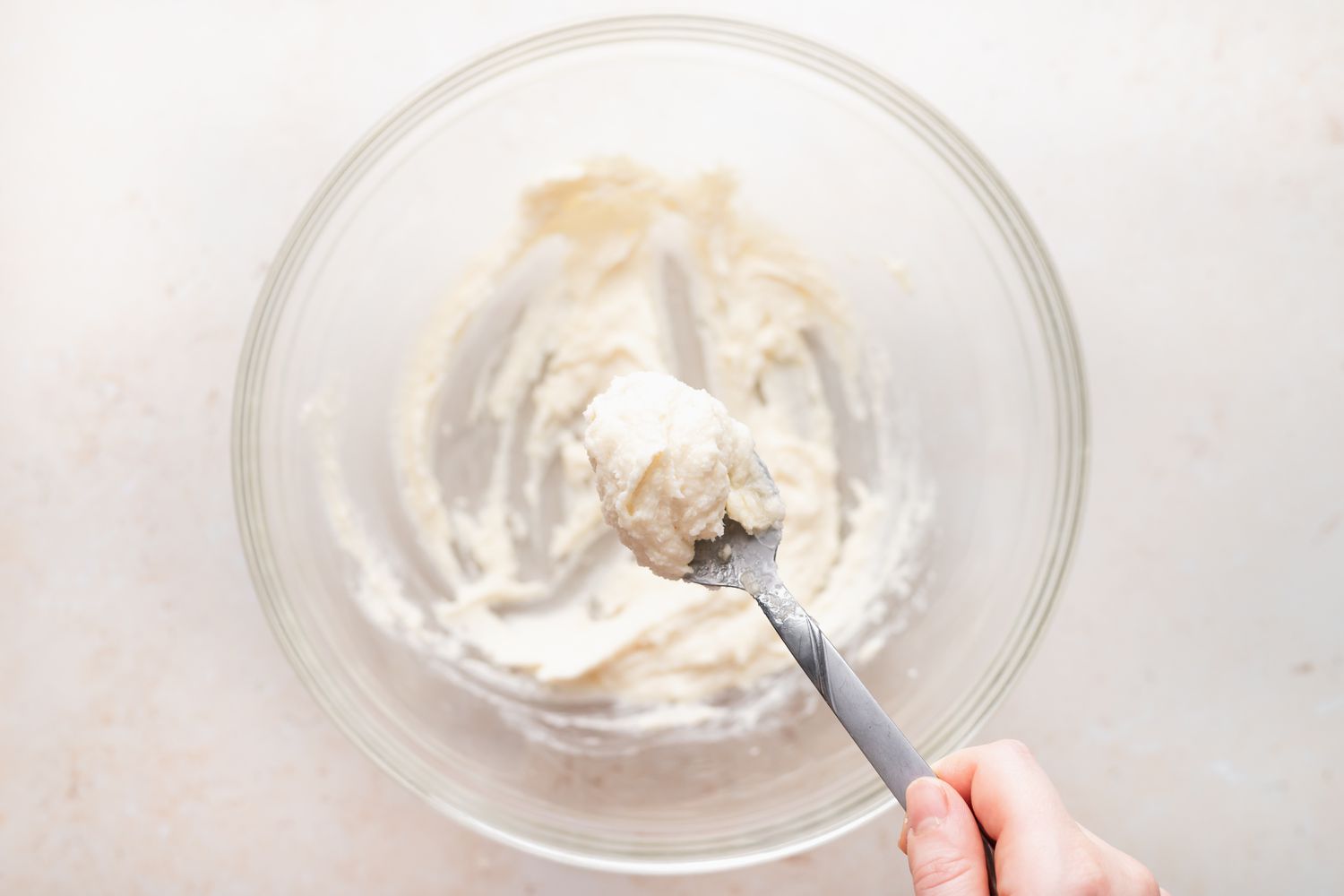 Mixing ingredients to make almond crescent cookies.