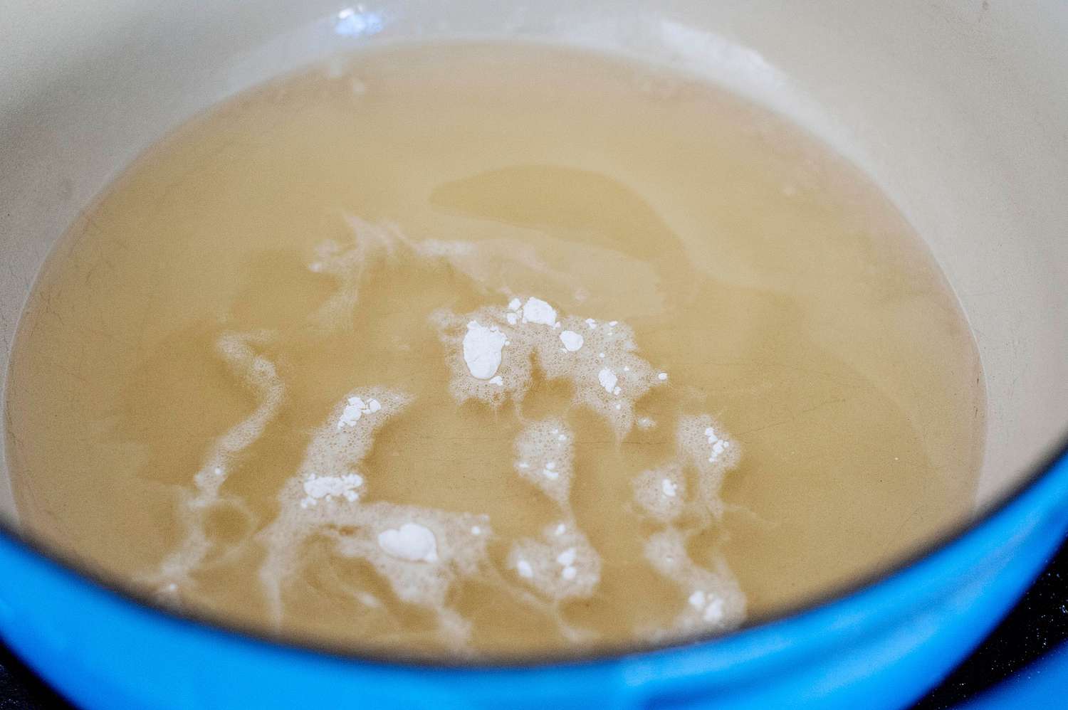 Dutch oven with oil to show how to make fried chicken.