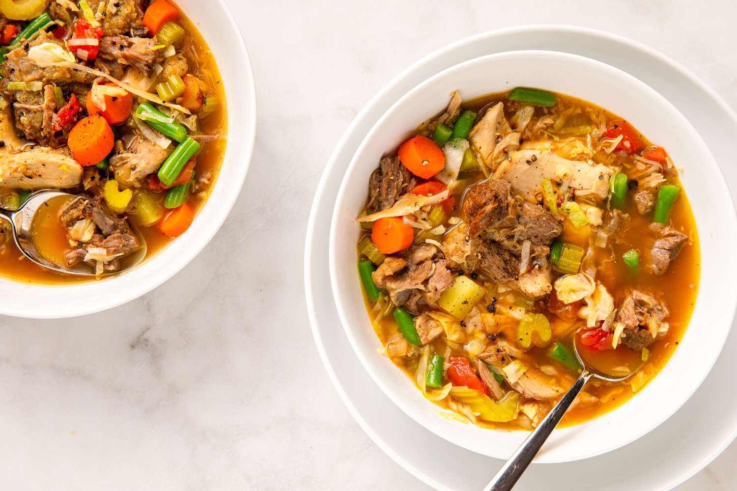 Bowls of Wisconsin booyah stew with vegetables and meat