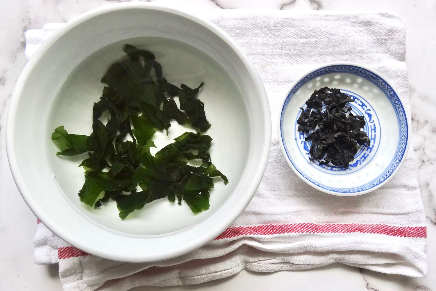 Rehydrating wakame in a bowl to make homemade miso soup.