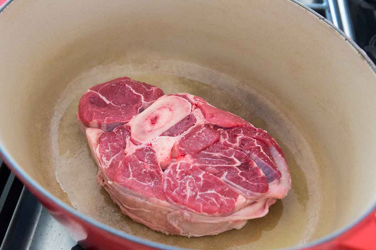 Raw beef shank in an oval Dutch oven