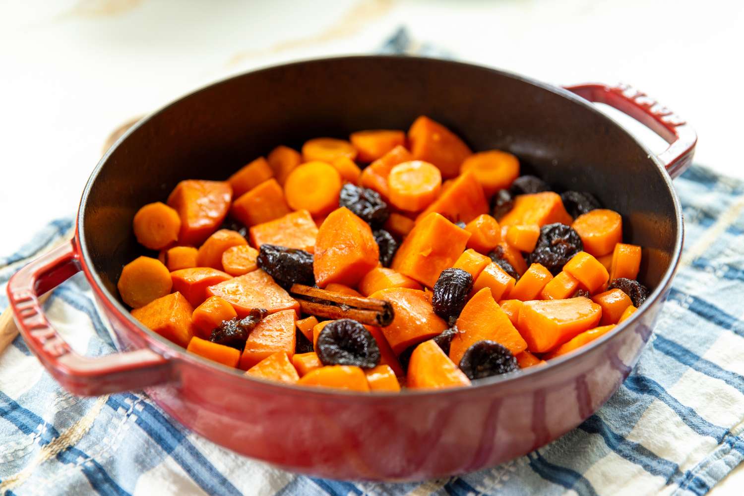 Carrot and Sweet Potato Tzimmes in a roasting pan