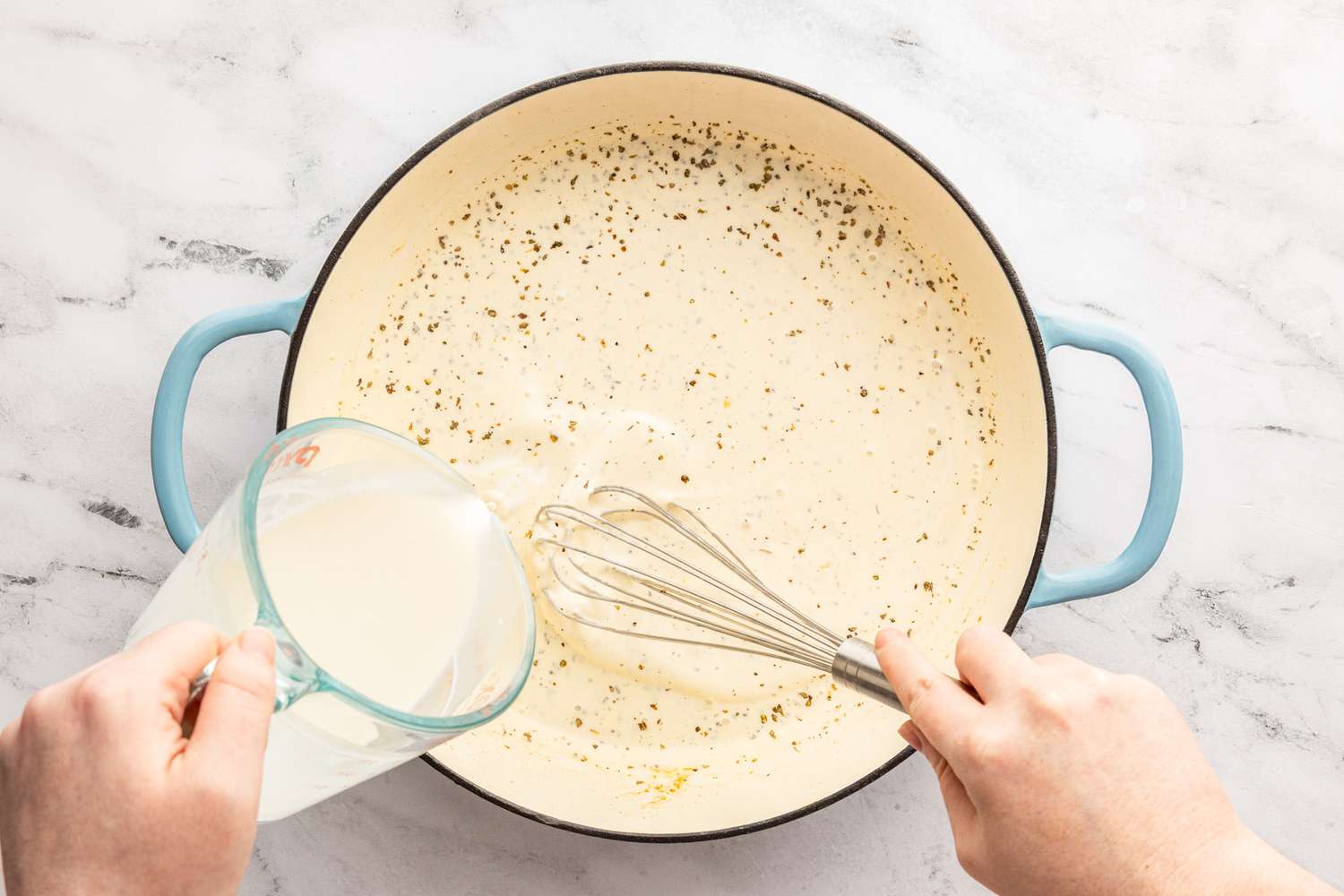 heavy cream whisked into the rest of the sauce ingredients in the pan for chicken caesar pasta recipe