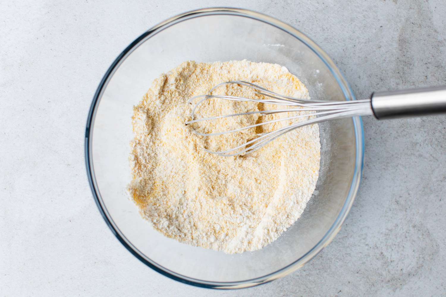 Dry Ingredients for Cheesy Skillet Cornbread Whisked in a Bowl