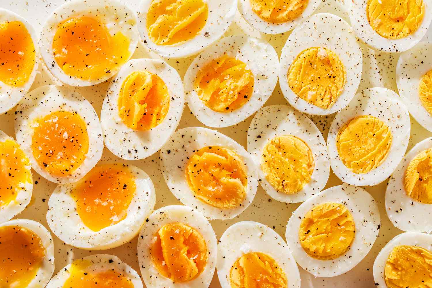 boiled egg halves topped with salt and pepper