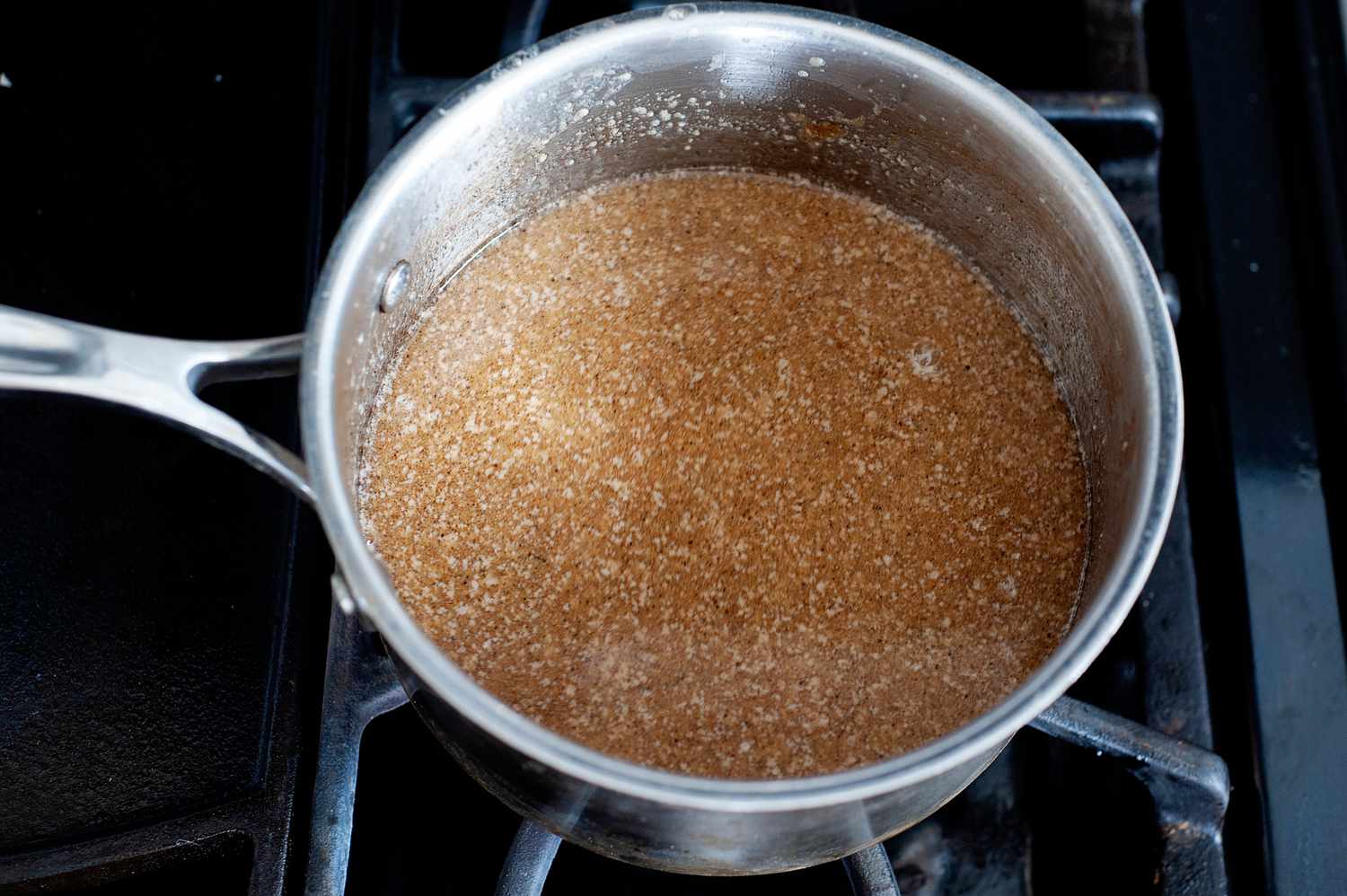 Making the caramel base for a butter pecan ice cream recipe.