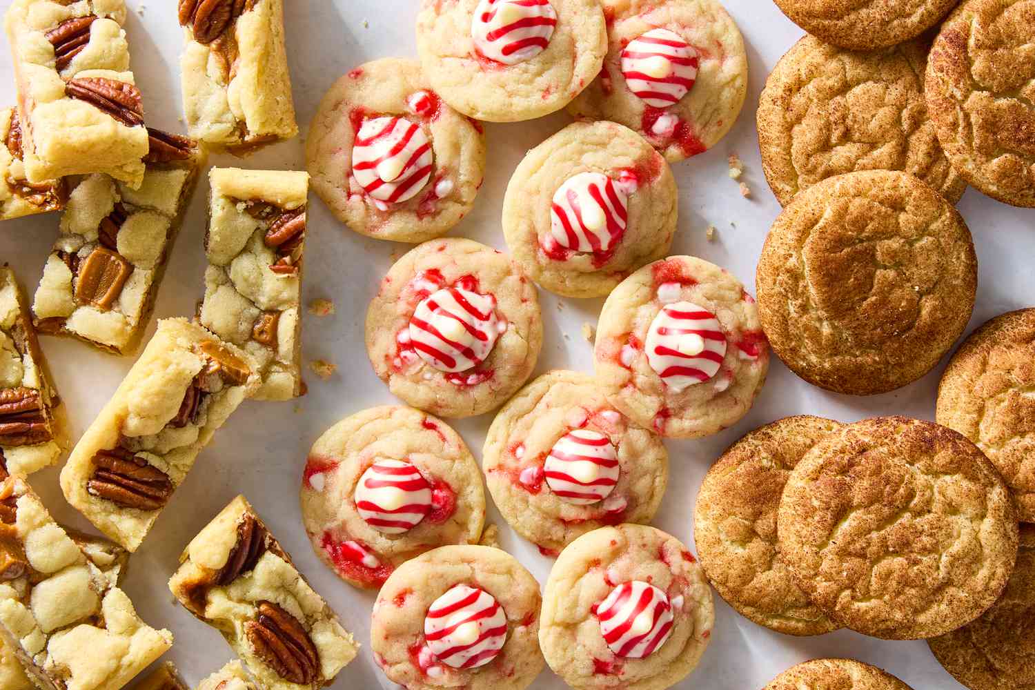 Overhead shot of assorted sugar cookies on a white background