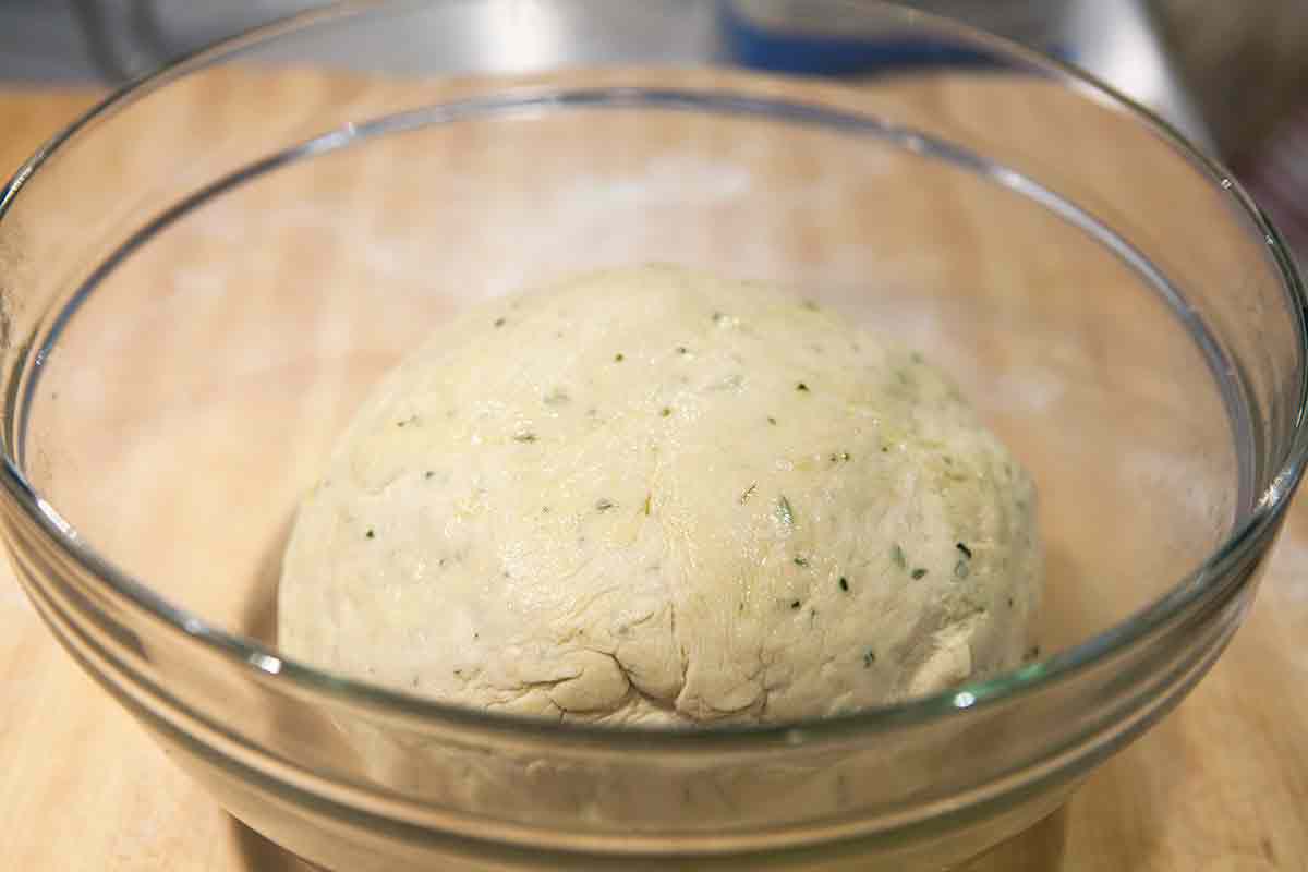Dough for rosemary focaccia in a bowl for the first rise