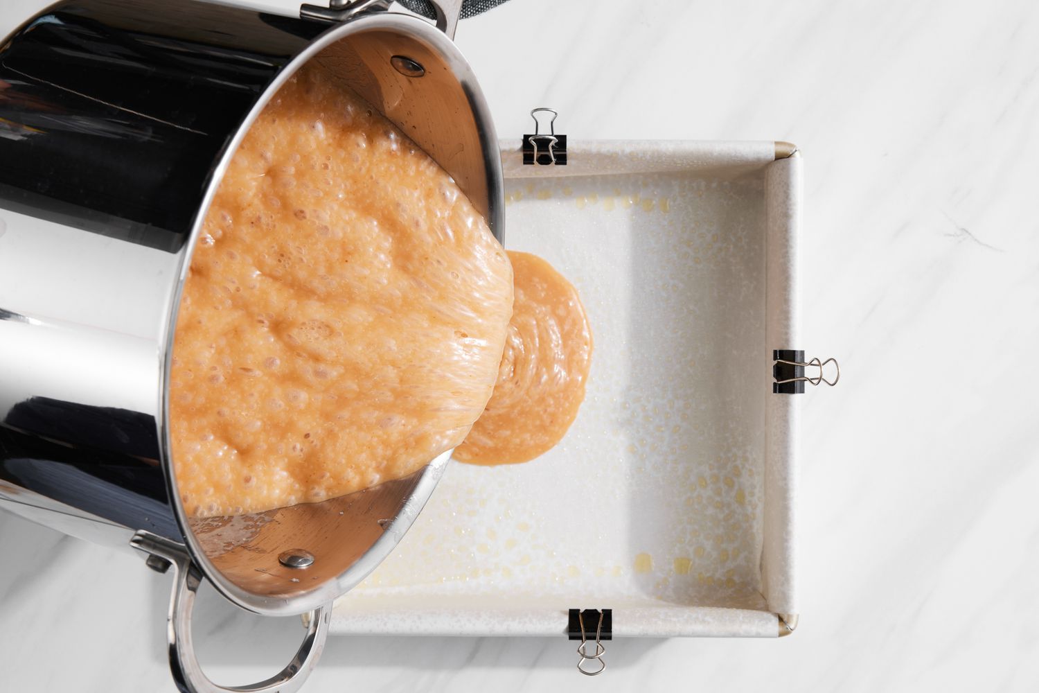 Pot of Caramel Poured into Lined Baking Pan
