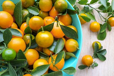 Bowl of Calamansi With Stems and Leaves 