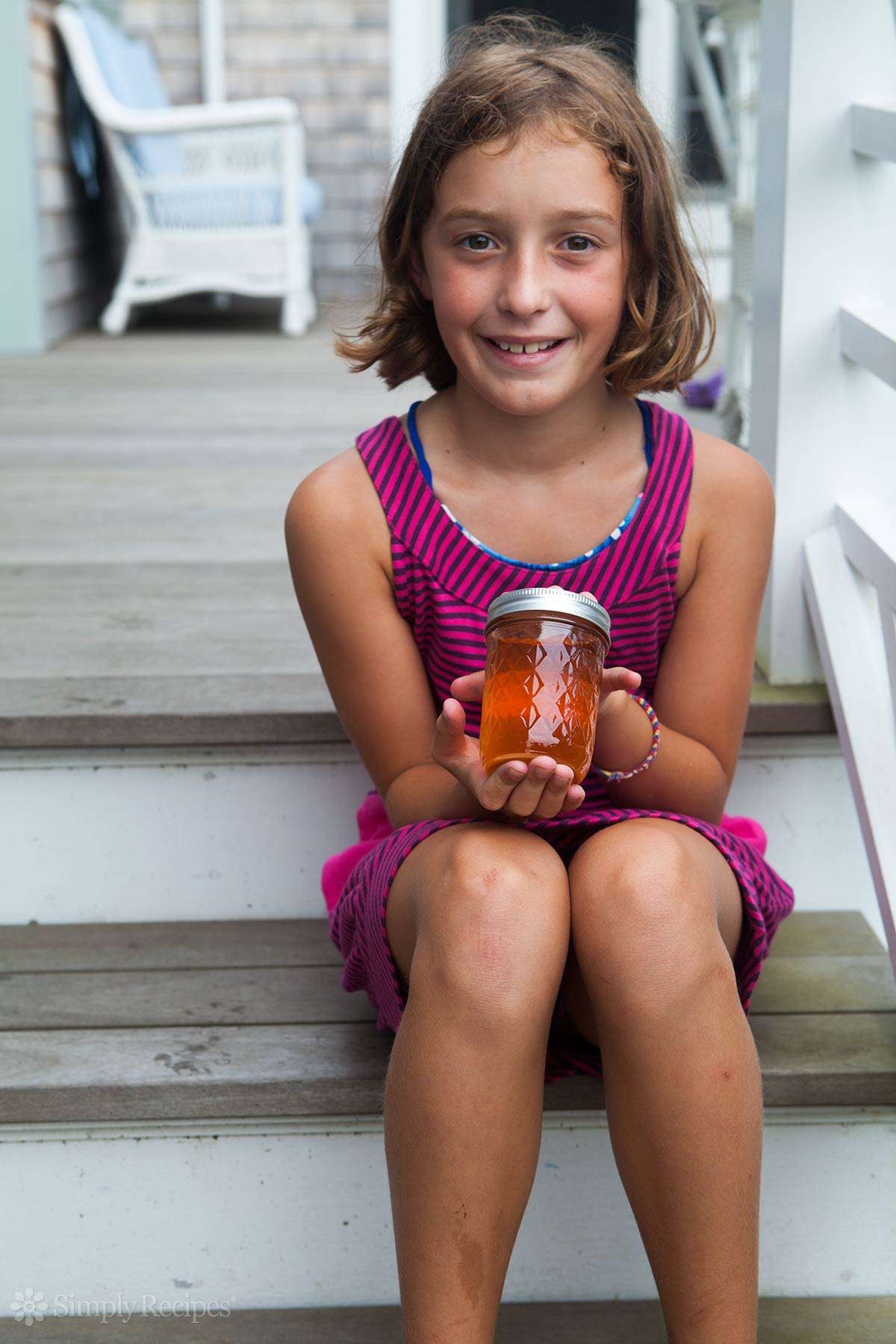 Alden holding rose hip jelly