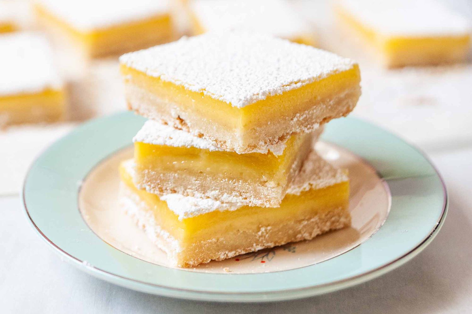 Lemon Bars Recipe - lemon bars on blue plate