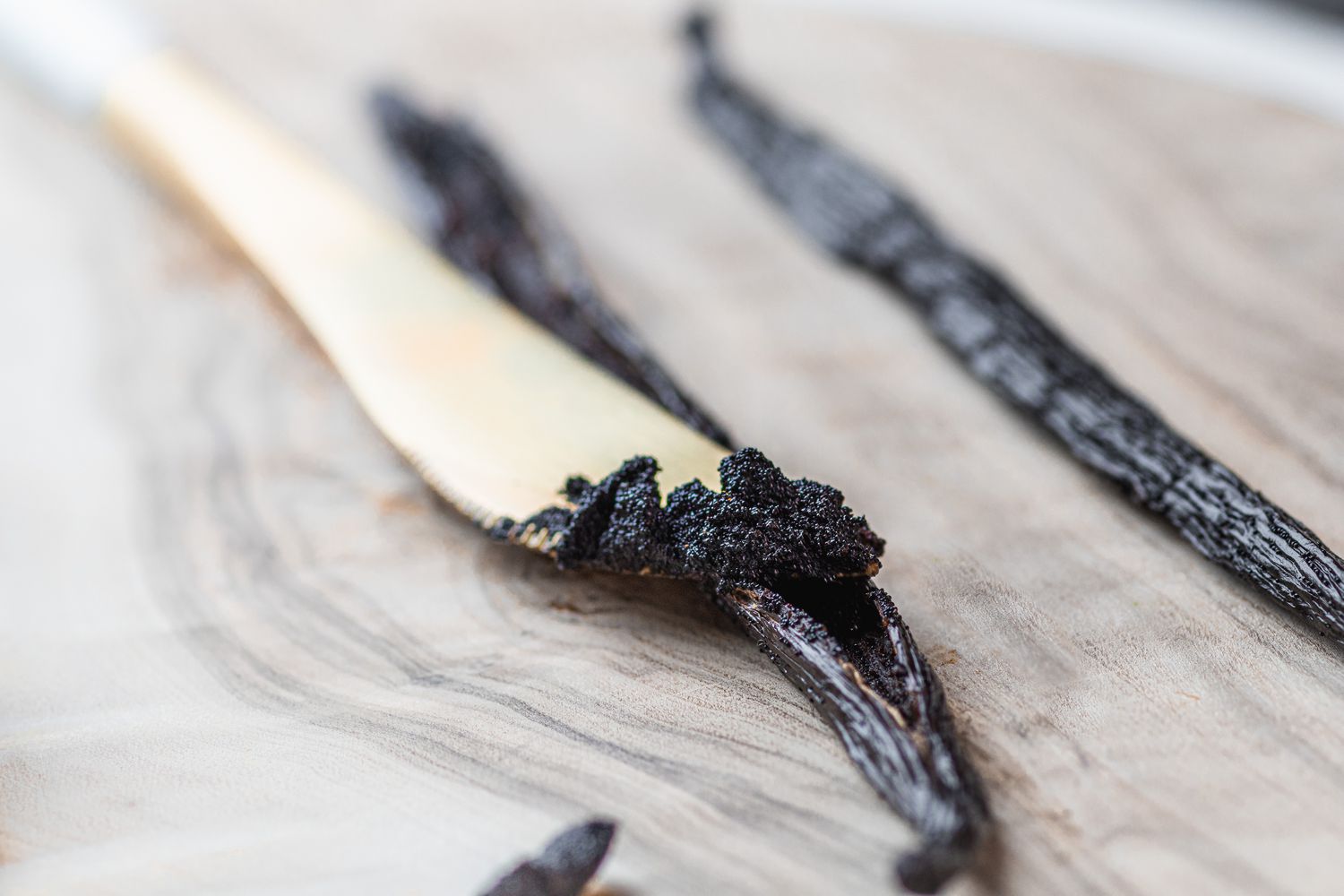 Scraping a vanilla bean to make a vanilla ice cream recipe.