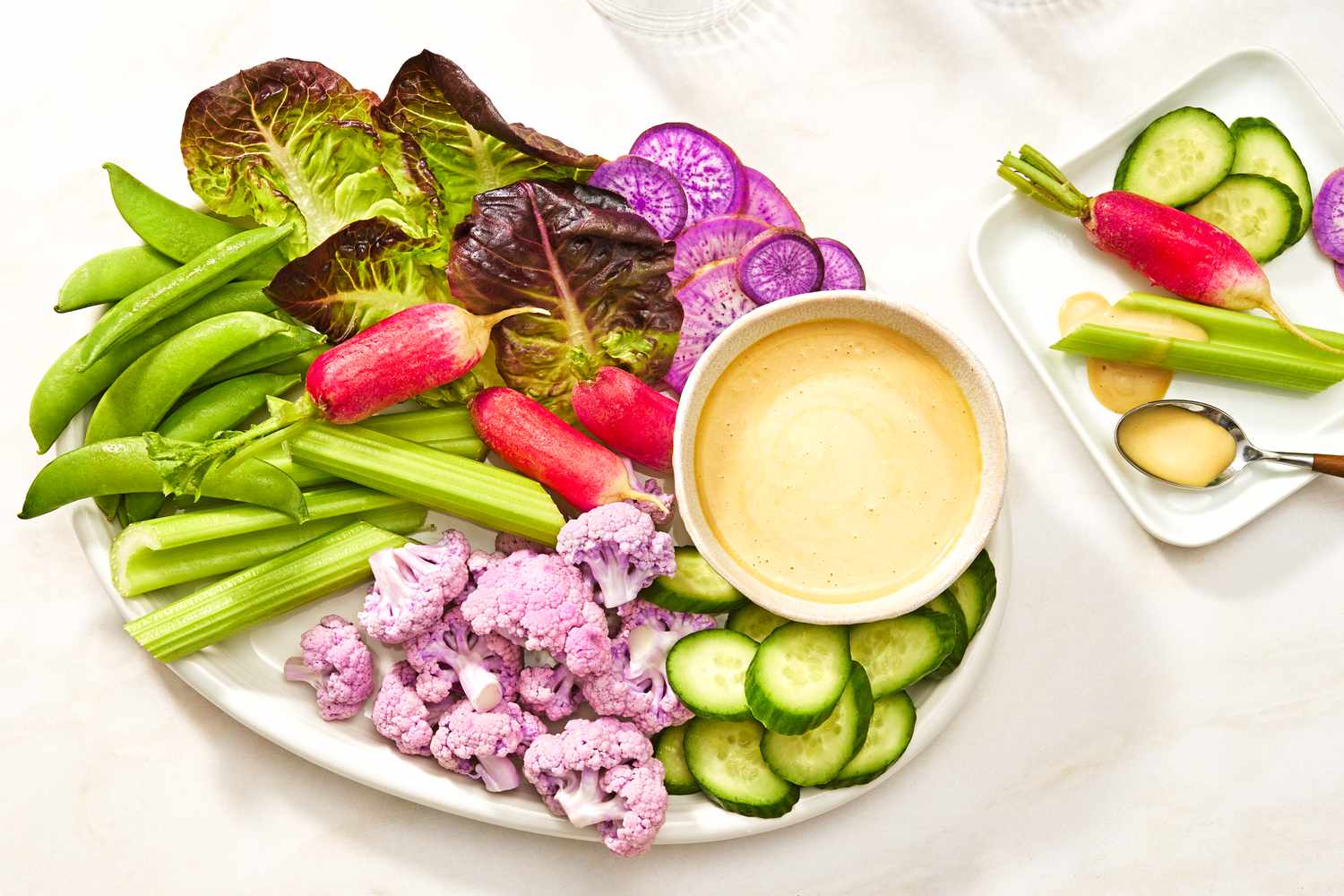 Vegetable platter with creamy mustard maple sauce in a bowl