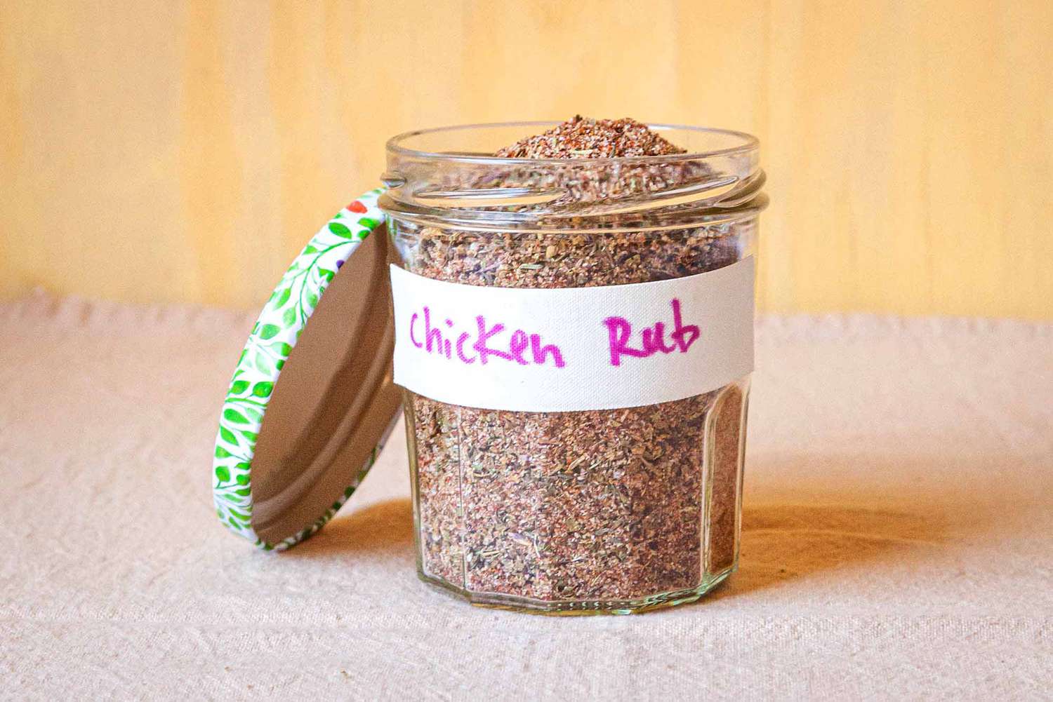 A jar filled with chicken rub dry spice