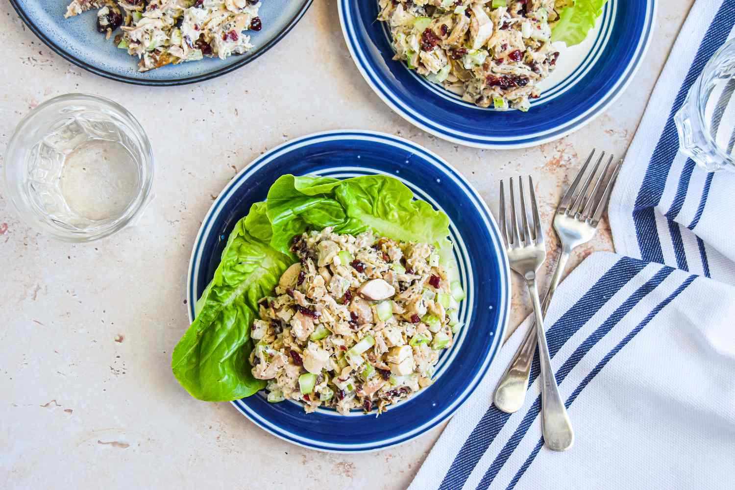 Plates of Tarragon Chicken Salad Next to a Glass and Forks