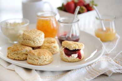 English-Style Scones on a tray with jam.